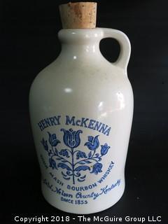 Collection including cleart glass fruit bowl, ceramic serving bowl and Henry McKenna Bourbon jug