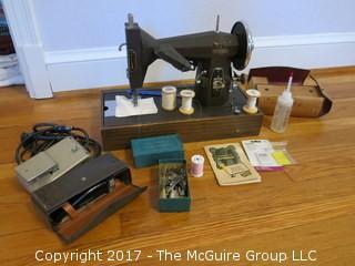 Vintage Kenmore sewing machine with accessories and case