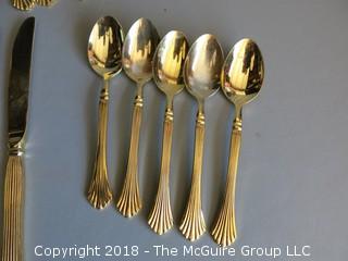 43 pieces of gold toned flatware 