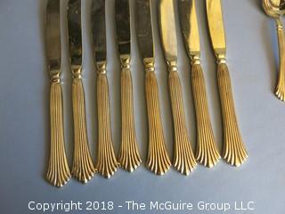 43 pieces of gold toned flatware 