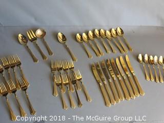 43 pieces of gold toned flatware 