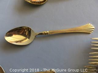 43 pieces of gold toned flatware 