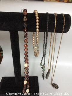 Collection of Five Necklaces Including Agate and Carved Bone Beads, Malachite Elephant, Brass Embedded in Wood Pendant