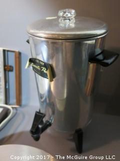 Collection of vintage hotplates and coffee percolator