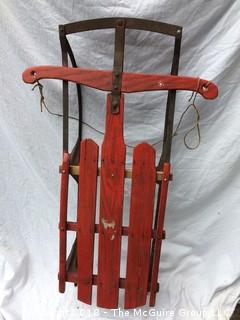 Old Red Wooden Sled with Metal Runners