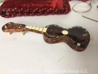 Collection of Velvet Victorian Photo Folder, Glass Paperweight, Pieces of Vintage Eyeglasses, and Mini Tortoiseshell Guitar