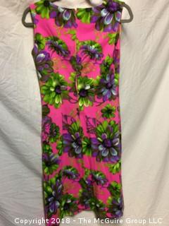 Vintage Women's Sleeveless Floral Dress with Pink Background