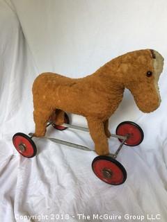 Vintage Stuffed Toy Horse on Metal Wheels