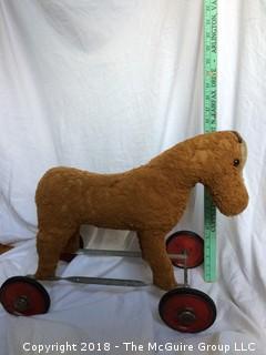 Vintage Stuffed Toy Horse on Metal Wheels