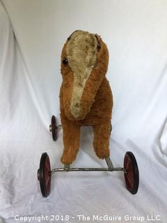 Vintage Stuffed Toy Horse on Metal Wheels