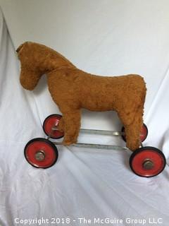 Vintage Stuffed Toy Horse on Metal Wheels