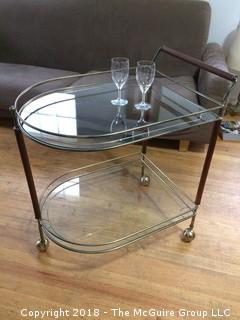 Mid Century Teak, Brass, and Glass Two-Shelf Bar Cart on Wheels