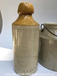 Collection of Four Clay Pots: Brown Pot from North Carolina, Clay Bottle, Pot with Lid and Handle, and German Salt-Glazed Pot with Handles