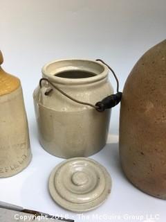 Collection of Four Clay Pots: Brown Pot from North Carolina, Clay Bottle, Pot with Lid and Handle, and German Salt-Glazed Pot with Handles