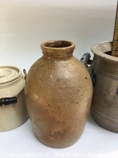 Collection of Four Clay Pots: Brown Pot from North Carolina, Clay Bottle, Pot with Lid and Handle, and German Salt-Glazed Pot with Handles