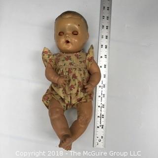 Sun Rubber Baby Doll with Skin Issues and Red Eyes