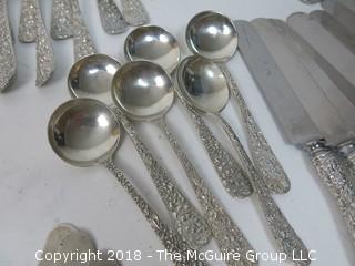 84 Piece Steiff Repoussee Sterling Flatware Cutlery Set; total weight (excluding knives); 2900g (8 teaspoons, 6 oversized dinner service spoons, 3 elongated dinner service spoons, 6 butter knives, 4 serving spoons, 7 large soup spoons, 6 small soup spoons, 5 tablespoons, 1 ladle, 4 cocktail spoons, 8 dinner knives, 8 dinner forks, 8 dinner spoons, 8 meat forks, 4 pickle forks)