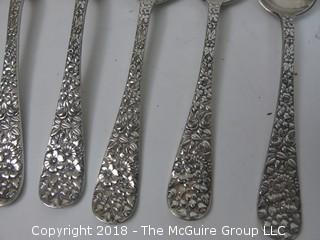 84 Piece Steiff Repoussee Sterling Flatware Cutlery Set; total weight (excluding knives); 2900g (8 teaspoons, 6 oversized dinner service spoons, 3 elongated dinner service spoons, 6 butter knives, 4 serving spoons, 7 large soup spoons, 6 small soup spoons, 5 tablespoons, 1 ladle, 4 cocktail spoons, 8 dinner knives, 8 dinner forks, 8 dinner spoons, 8 meat forks, 4 pickle forks)