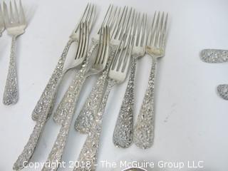 84 Piece Steiff Repoussee Sterling Flatware Cutlery Set; total weight (excluding knives); 2900g (8 teaspoons, 6 oversized dinner service spoons, 3 elongated dinner service spoons, 6 butter knives, 4 serving spoons, 7 large soup spoons, 6 small soup spoons, 5 tablespoons, 1 ladle, 4 cocktail spoons, 8 dinner knives, 8 dinner forks, 8 dinner spoons, 8 meat forks, 4 pickle forks)