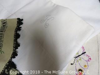 Collection of textiles including needlework tableclothes, napkins, doilies