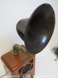 Working AM/FM "Antique style" radio with big horn bolted to the top; original speaker in the front grill, and a new "up-firing" midrange speaker mounted below the horn