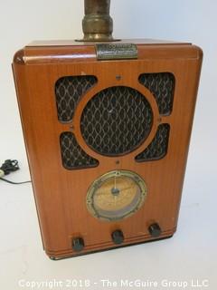 Working AM/FM "Antique style" radio with big horn bolted to the top; original speaker in the front grill, and a new "up-firing" midrange speaker mounted below the horn