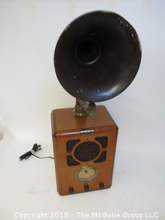 Working AM/FM "Antique style" radio with big horn bolted to the top; original speaker in the front grill, and a new "up-firing" midrange speaker mounted below the horn