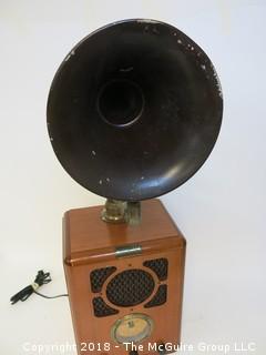 Working AM/FM "Antique style" radio with big horn bolted to the top; original speaker in the front grill, and a new "up-firing" midrange speaker mounted below the horn