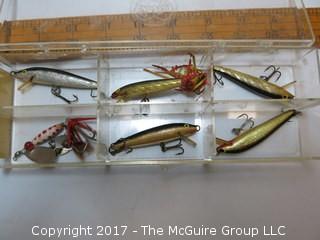 Collection of fishing gear including lures, lines and reels