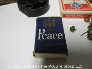 Assortment including "Peace Cigarettes, Button's Raven Gloss Shoe Polish, pack of poker playing cards and cribbage board. 