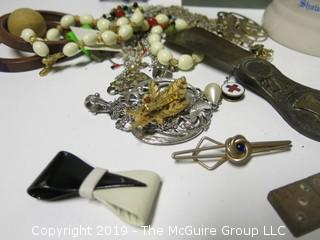 Collection including wooden dominoes, costume jewelry, beer stein, office stamper and granite bookend 