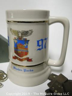 Collection including wooden dominoes, costume jewelry, beer stein, office stamper and granite bookend 