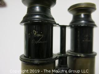 Binoculars; words etched "181 Strand; London" and "(illegible) Opticians"