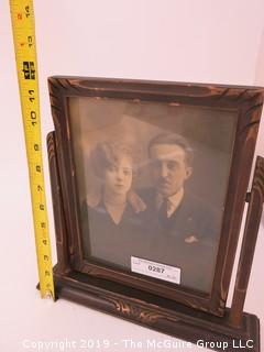 Portrait of Couple in wood carved swivel frame; 12" tall 