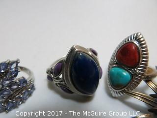 Collection of (4) sterling rings and brooch; sizes left to right in photo: 5 1/4;7;7 3/4;7