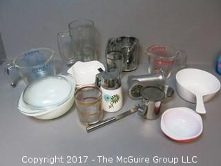 Collection of mid-century dishware including Corning, Pyrex, sifter and liter glass mug