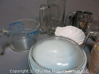 Collection of mid-century dishware including Corning, Pyrex, sifter and liter glass mug