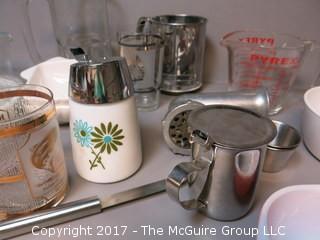 Collection of mid-century dishware including Corning, Pyrex, sifter and liter glass mug