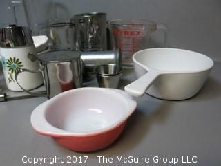 Collection of mid-century dishware including Corning, Pyrex, sifter and liter glass mug