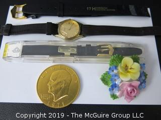 Collection including 2 NOS watch bands, 1 watch and a English bone china floral pin by Denton, 