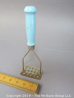 Potato Masher; wood handle; sky blue paint