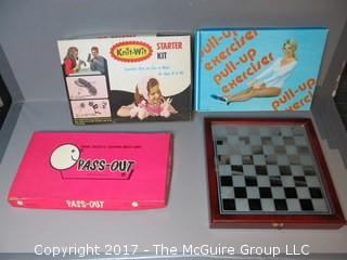 Collection including vintage board games, glass chess set and 1970's pull-up exerciser