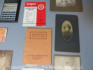 Collection including early photographs, playbills, M-C advertising, and pocket calculator