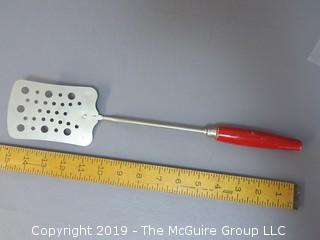 Slotted Spatula with wood handle; painted red, Indian Chief trademark