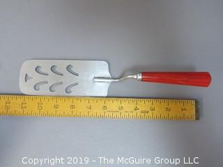 Slotted Spatula with red bakelite handle