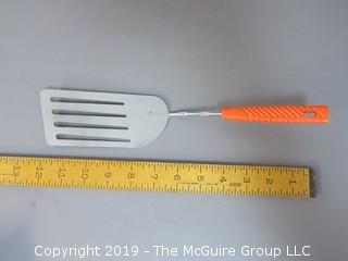 Slotted Spatula with plastic orange handle