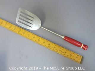 A&J Slotted Spatula with red bakelite handle