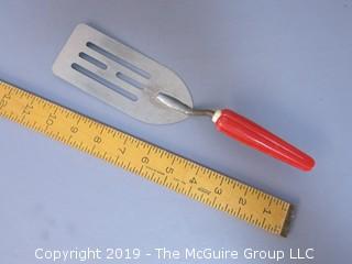 Slotted Spatula with red bakelite handle