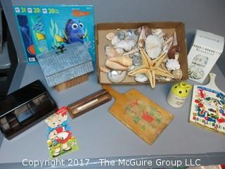 Collection including sea shells, vintage cutting boards, vintage Valentine's Day Card, (3) NIB Nemo puzzles and a botanical jar 