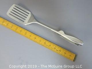 Handle activated "flipper" metal slotted spatula; marked E Z Flipper